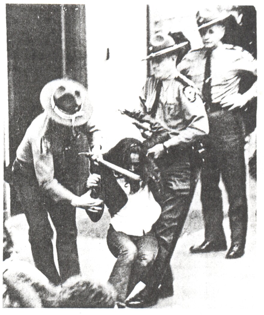 Officers removing students from Rowan Hall.